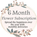 A circular image with a green wreath frame, featuring text that announces a 6 Month Flower Subscription with the tagline 'Spread the happiness over the year with monthly deliveries'.