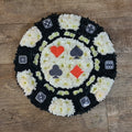 A floral arrangement resembling a 2D poker chip design