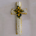 A 4ft (120cm) white cross with yellow rose spray and decorative ribbon.